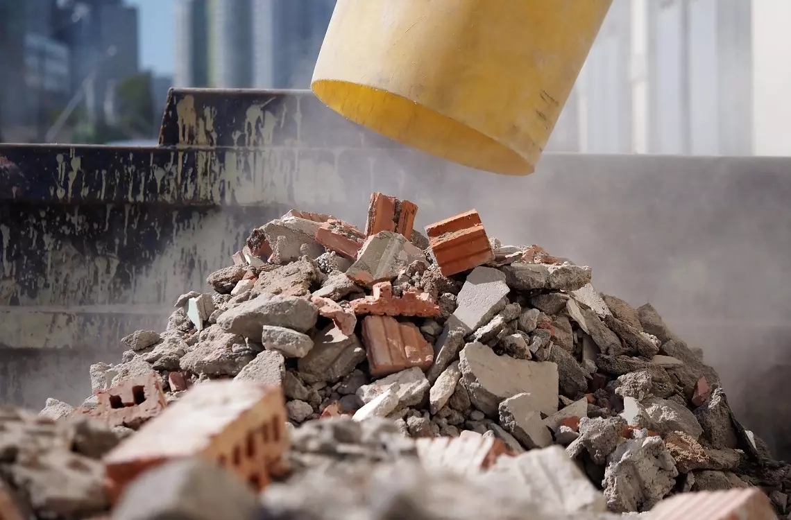 construction garbage dumping yellow hose. recycling