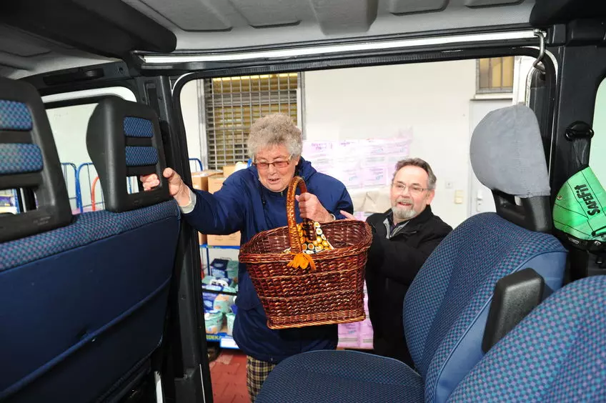 Picture showing an old lady entering a paratransit vehicle