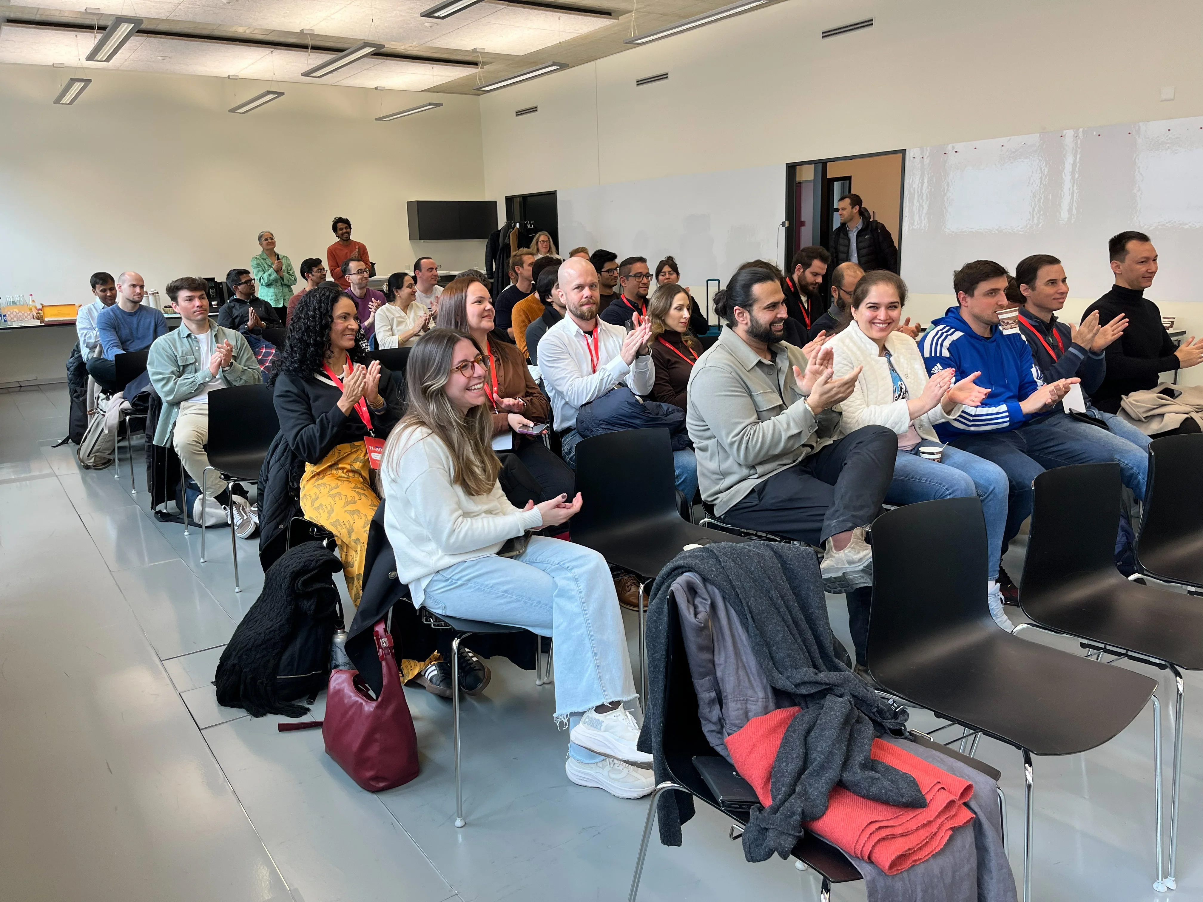 AIT participants listening to an input and taking notes.