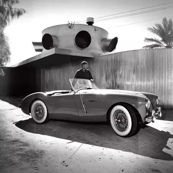 Albert Frey with car in front of Frey House 1, after addition, Palm Springs, Calif., circa 1950.