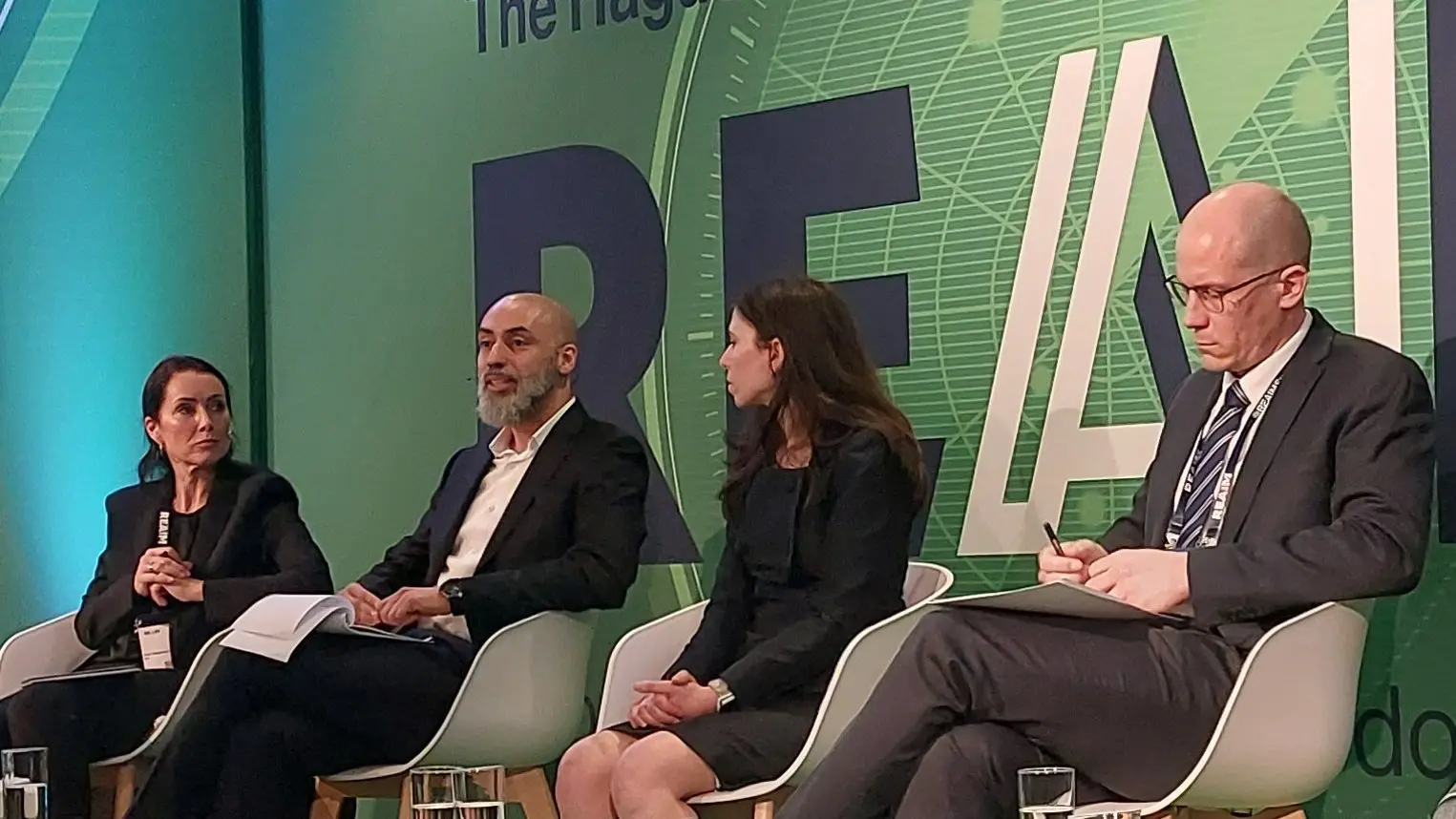 CAI Expert Ricardo Chavarriaga (second from the left) speaks at the REAIM summit