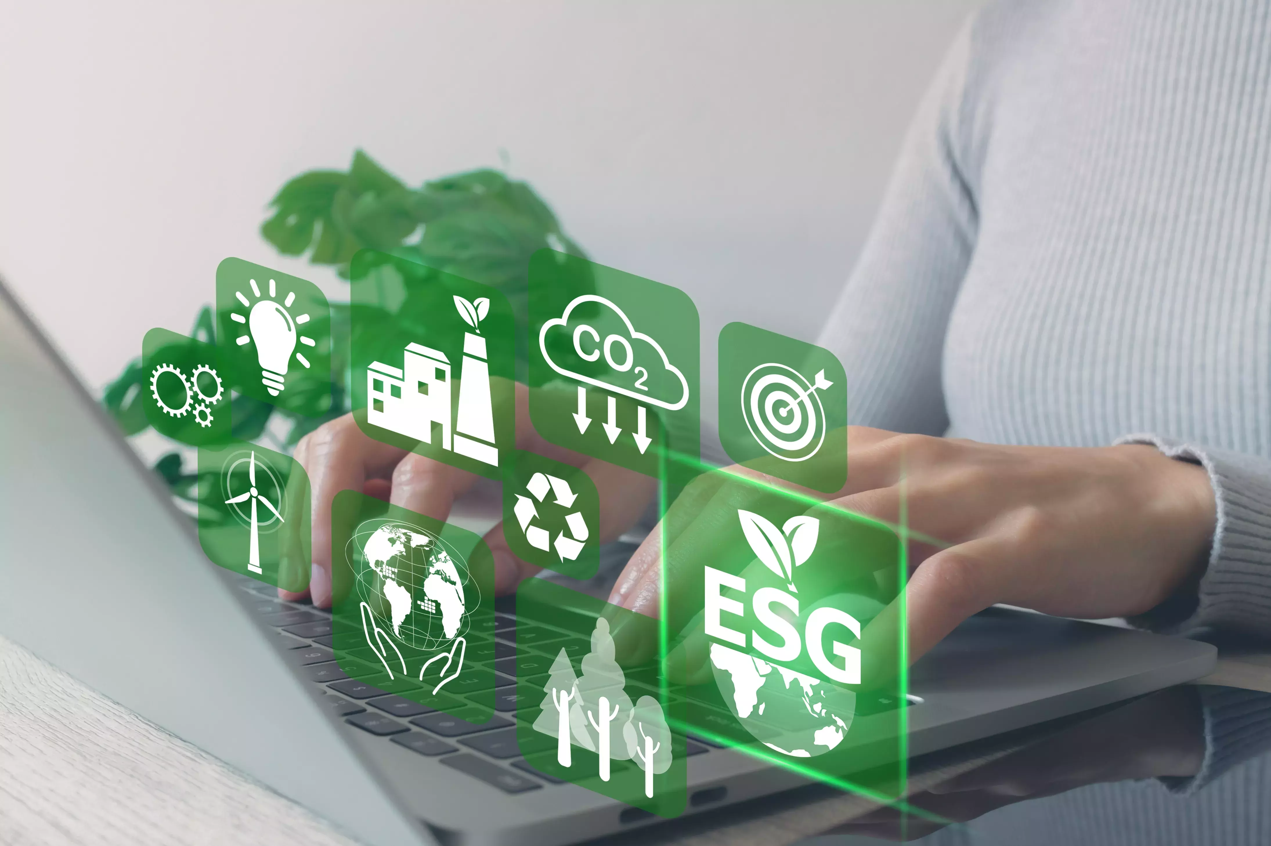 Women use a laptop computer to analyze ESG icon.plan to renewable resources to reduce pollution and carbon emission ,environment social governance investment Net zero concept.