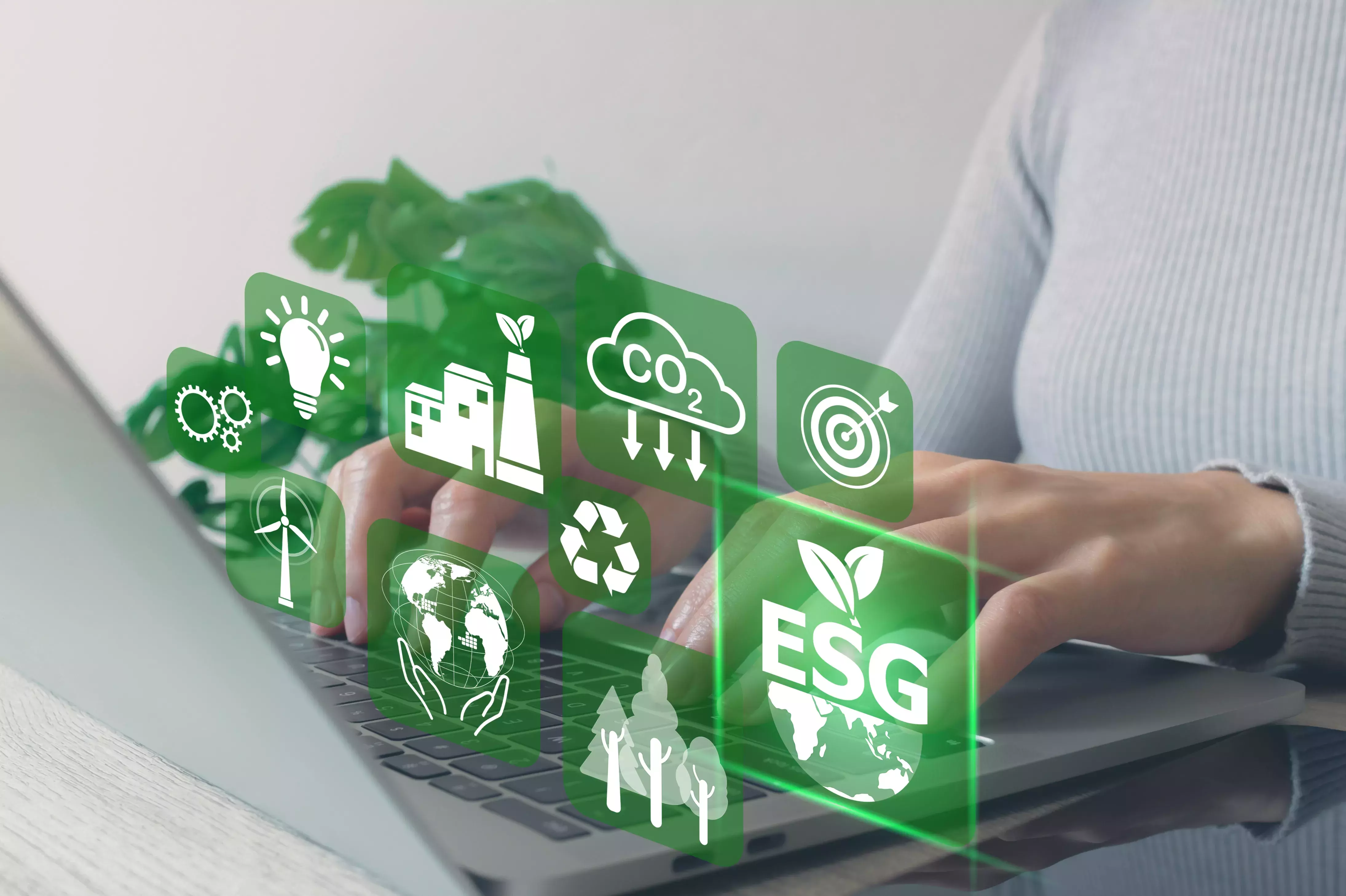 Women use a laptop computer to analyze ESG icon.plan to renewable resources to reduce pollution and carbon emission ,environment social governance investment Net zero concept.