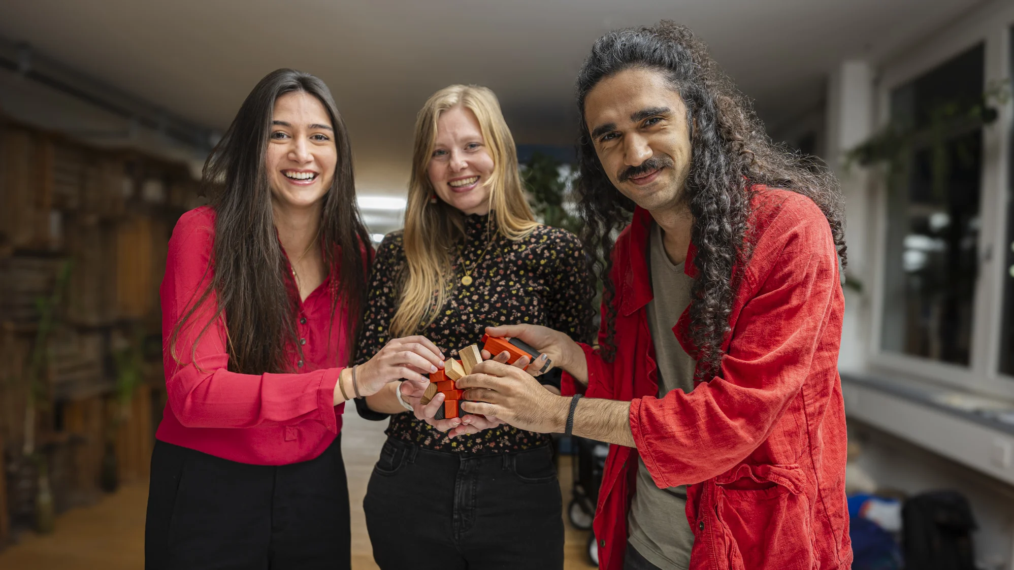Group photo from the project team holding their game. 
