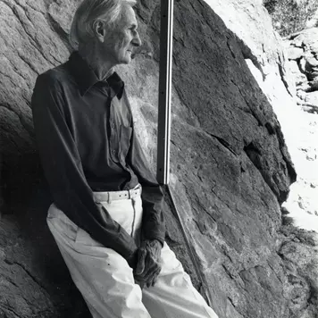Albert Frey in Frey House 2, leaning against the rock inside the house, Palm Springs, Calif., circa 1995.
