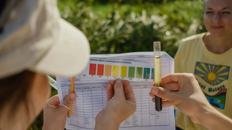 Participants determine the acidity of an agricultural soil.